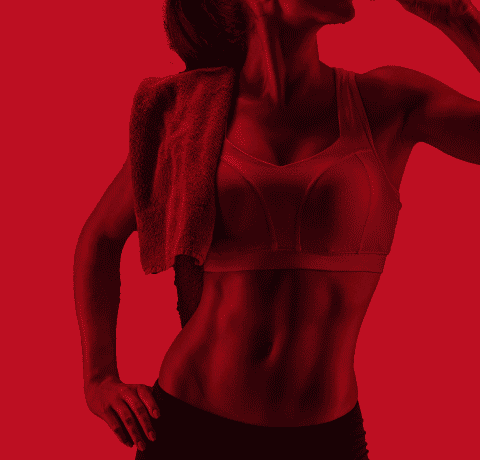 Fitness woman. Young and ripped. abs showing and wearing a sports bra.